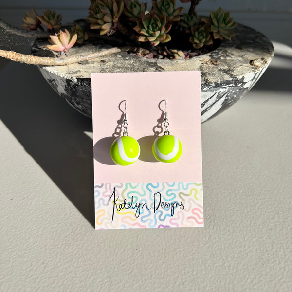 Tennis ball L dangles